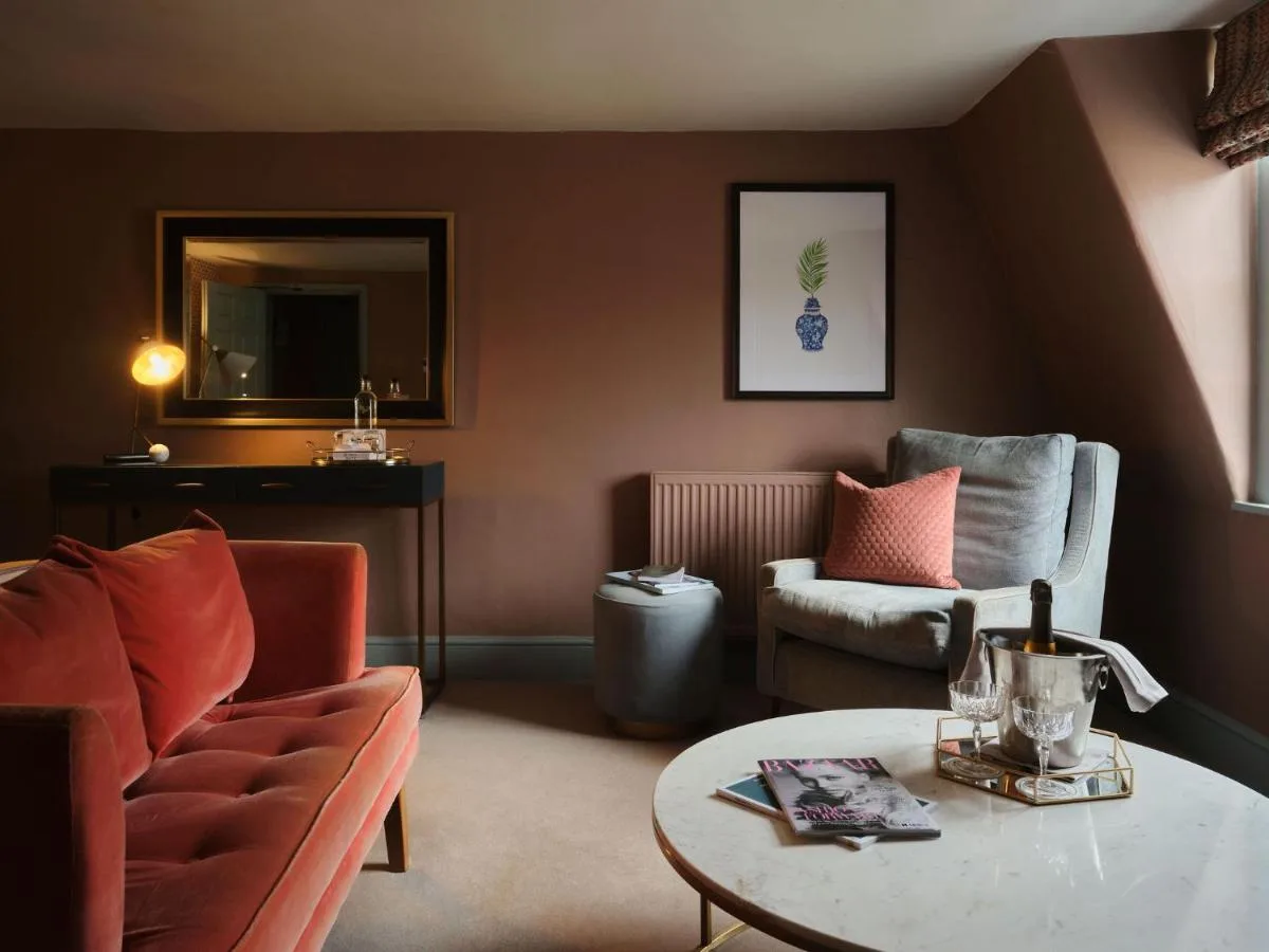 A living room with a couch and a table at The Queensberry Hotel in Bath