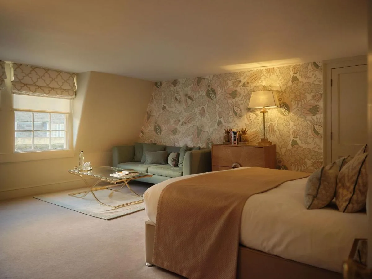 A bedroom with a bed and a couch at The Queensberry Hotel in Bath